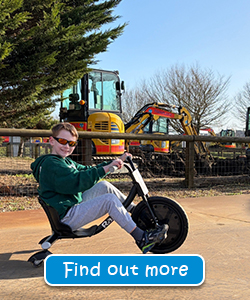 Crazy Trikes Ride at Diggerland UK Theme Park Children riding black razor trikes